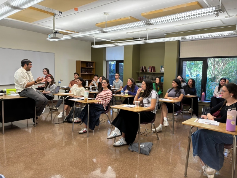 Teacher leading classroom discussion